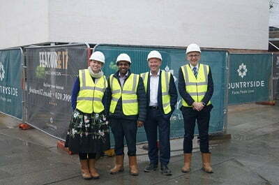 4 Construction workers outside the Co-op