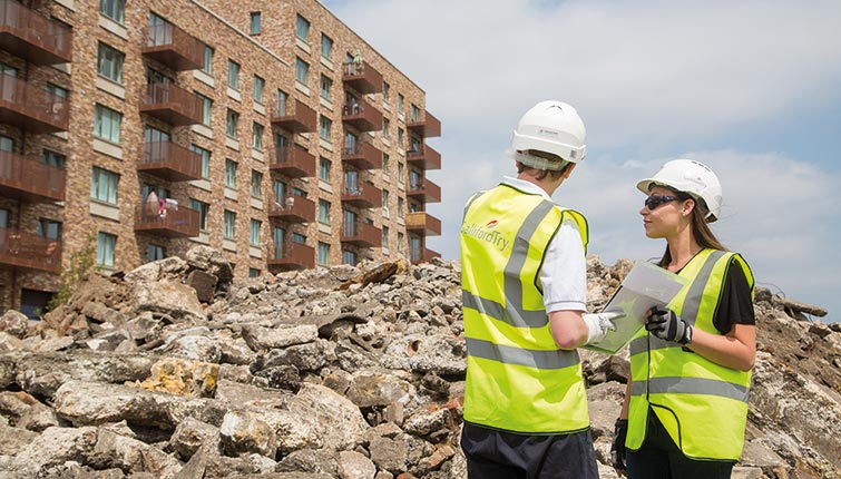 Two construction workers on site