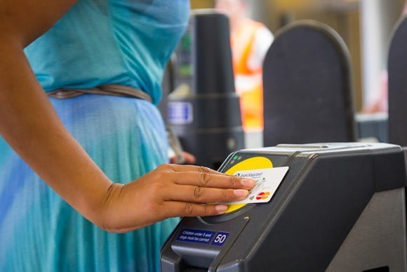 Women scanning her train ticket