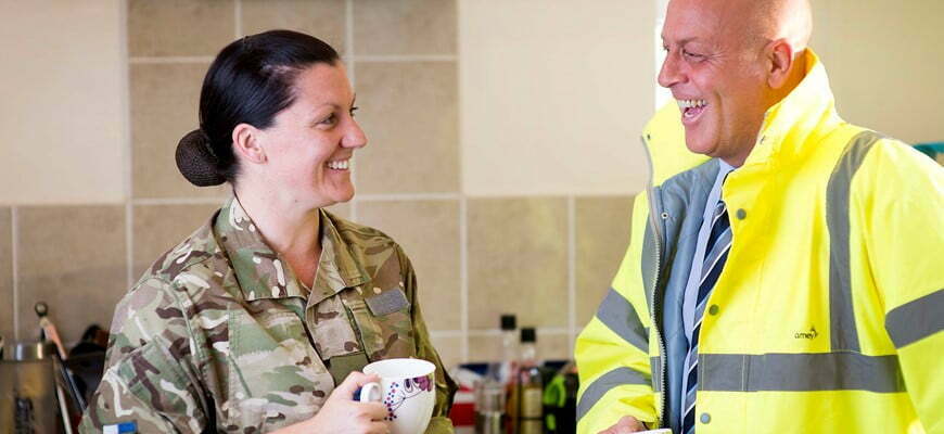 Amey and military employee's talking.