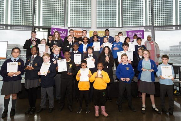 Participating schools have achieved an average eight per cent reduction in car use on the journey to school Almost half of London schools are accredited to TfL’s STARS programme to encourage active and safer travel Research shows that a quarter of weekday morning peak car trips are for school drop-offs Twenty eight schools from across London have been celebrated by Transport for London (TfL) for their work championing active and safe travel on the journey to school. As part of TfL’s STARS (Sustainable Travel: Active, Responsible, Safe) schools programme, the winners received awards for being the highest performing of around 1500 participating London primary and secondary schools in reducing car use, increasing walking and cycling and using public transport. All STARS schools ran initiatives that have led to an average of eight per cent reduction in car use on school journeys. STARS is now in its twelfth year, and accreditation to STARS has grown from 180 schools in 2007 to 1,465 in 2018. Schools are judged on their success in changing travel behaviour with each school awarded a Bronze, Silver or Gold accreditation. This year 686 schools were awarded a Gold accreditation - more than ever before. Certificates from the Mayor of London were presented to the top performing schools at the annual event at City Hall. Dr Will Norman, London’s Walking & Cycling Commissioner, said: “We all want to build a healthier and safer future for our children so to have them involved in encouraging us all to be more active and safe is fantastic. The Mayor and I are particularly proud of the STARS programme. Every participating school deserves an award and should be proud of their achievements. These top 28 schools have shown particular innovation in their projects. “Being physically active sets children up for success: active kids are healthier, happier and do better at school. Sadly, far too many children in London aren’t as active as they should be. Walking, cycling and scooting to school are fun and easy ways to build more activity into the day.” Gareth Powell, TfL’s Managing Director of Surface Transport, said: “TfL's STARS accreditation scheme inspires young Londoners to think differently about travel and its impact on their health, wellbeing and the environment. This year, we have awarded gold status to 686 schools, more than ever before. We are delighted that so many schools across London are part of the programme and we’re determined to double that number, enabling more London children to enjoy the benefits of leading active lives.” The overall best regional primary and secondary schools include: Lordship Lane Primary – for work to discourage parents from parking near the school including creating a five minute walking zone and holding two play street events outside school to show parents how it could be without cars (Haringey, north London) Oakleigh School and Acorn Assessment Centre – during Road Safety Week every class had a 20 minute presentation using travel related music, sensory objects and lights (Barnet, north London) Gilbert Colvin Primary – have worked incredibly hard this year with their ‘Stripey Strider’ campaign to get a zebra crossing outside their school (Redbridge, east London) The Campion School – have delivered a year-long three part campaign aiming to increase the numbers of those cycling to school (Havering, east London) Herne Hill Primary – for devising ‘numerous fun and interactive travel initiatives’ to promote local safe travel initiatives including a Clean Air Day and inviting external speakers to speak to pupils (Southwark, south London) St Mary Magdalene School - for their innovative three-part Spokestars initiative that develops cycling skills from the bottom up. Level one focuses on balance bike training, level two - transitioning to pedal bike and level three - basic bike maintenance (Greenwich, south London) St Mary’s Bryanston Square CE Primary – the school has undertaken an intensive programme of activity this year including a clean air project that including air quality lessons, removing car parking spaces, installing scooter parking and raising money to fund an eco-garden in a former school car park (Westminster, west London) Guru Nanak Sikh Academy – the Academy has undertaken an intensive campaign to improve road safety in Hayes which included creating ‘More Than You’, a powerful film highlighting the consequences of a road traffic incident. The film was premiered at a Road Safety Fair which included a road safety obstacle course, a smoothie bike as well as travel inspired games & activities. 750 students attended the event. (Hillingdon, west London) Prior to this event, other STARS accredited schools received Bronze, Silver and Gold grading for their initiatives at seven regional events held across London. They also shared best practice and pledged to increase their activities. As well as TfL’s work to encourage walking, cycling and scooting to school, councils like Camden and Hackney are also piloting schemes where streets around primary schools are closed at set times in the morning and afternoon, allowing people to walk and cycle safely in a pleasant environment. Waltham Forest is also discouraging motorists from idling their engines at drop off and pick up times. The first Walking Action Plan was launched earlier this year. As part of this, TfL, the Mayor and others are delivering a number of projects that promote healthy, walkable school journeys and make it easier and more appealing for parents and children to walk or cycle to school. The Walking Action Plan includes the target to double the number of schools reaching the Gold standard under the STARS scheme, from 686 currently to 1,000 by 2024. Research from TfL’s Walking Action Plan, which aims to make London the world’s most walkable city, shows that a quarter of weekday morning peak car trips are for school drop-offs, a total of 254,000 trips a day. Those cars would form a traffic jam more than 1,000km long if they were queuing in single file. This increased traffic has an impact on congestion, air quality, safety and the efficiency of London’s roads. The STARS scheme and the Walking Action Plan are part of the Mayor’s Transport Strategy, which aims for 80 per cent of journeys to be made by walking, cycling or public transport. For further details on the STARS accreditation scheme and the full range of programmes TfL offers to schools and young people, visit tfl.gov.uk/stars or tfl.gov.uk/younglondon.
