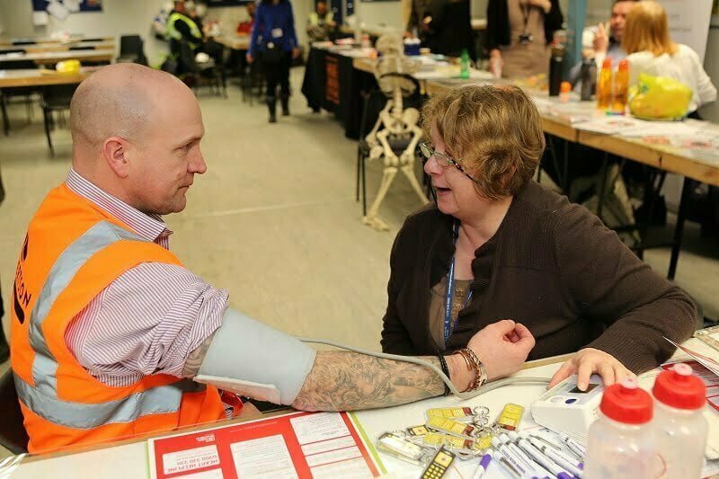 Perth-based subcontractors working at the site of the new Bertha Park High School have enjoyed a free event promoting a healthy working environment. Held in partnership between Robertson – the primary contractor for the new school – and NHS Tayside Healthy Working Lives, the pop-up event included stalls from several professional organisations offering advice in areas including health and safety, mental wellbeing, physiotherapy, energy and financial planning. Attendees also had the chance to try out the Sense Scotland exercise bike, which produces pedal-powered smoothies. Kevin Dickson, Managing Director of Robertson Tayside, said: “The wellbeing of not only our own employees but those of our supply chain is of the highest priority to Robertson. “It’s important that we facilitate events like Healthy Working Lives so everyone is aware of the support that is available to them, not just for issues within the workplace but for wider reasons that may be having a knock-on impact on their wellbeing and happiness at work.” Robertson is a Healthy Working Lives Bronze accredited employer, which recognises the companies that are ensuring the work employees undertake will not adversely affect their health and indeed can improve their mental, physical and social health. Sylvia Mudie, Senior Health Promotion Officer with NHS Tayside, said “Events such as these are helpful because they provide a range of information and highlight the importance of health, safety and wellbeing at work close to where people work. There are a wide range of services available in Tayside and many find it helpful to get some one-to-one advice on where to go.” The event was also supported by Perth & Kinross Credit Union, Scottish Sleep Apnoea Association, Sense Scotland, Working Health Services, Health and Work Support and Home Energy Scotland. Construction of the £32.5million Bertha Park High School is expected to complete later this year, marking the completion of Scotland’s first brand new school in over 20 years. Part of the Scottish Government’s Schools for the Future programme, it is unique as it is an entirely new school and not a replacement of an existing one