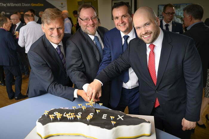 Speakers cutting the cake