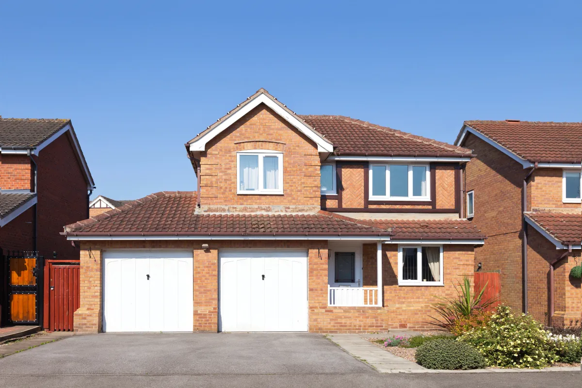 Double Garage Doors on a detached house - image source: Deposit Photos