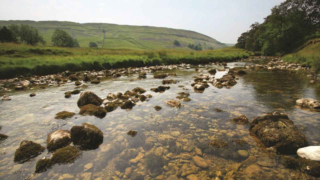 The Yorkshire river surrounded by acres of green land