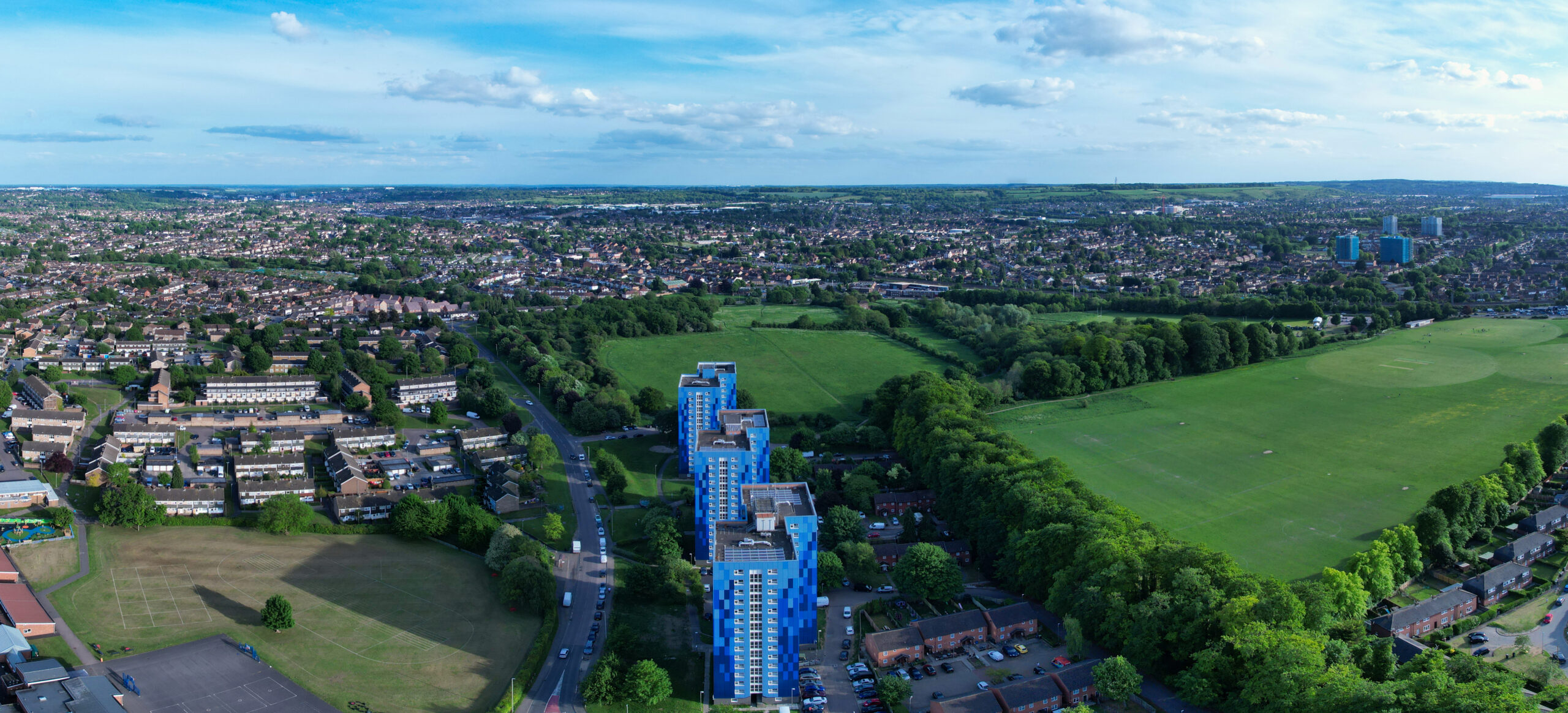 Ariel panoramic view of Great Britain, showing acres of green land, industrial buildings and homes