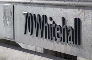 a grey marble plague reading '70Whitehall' in black lettering