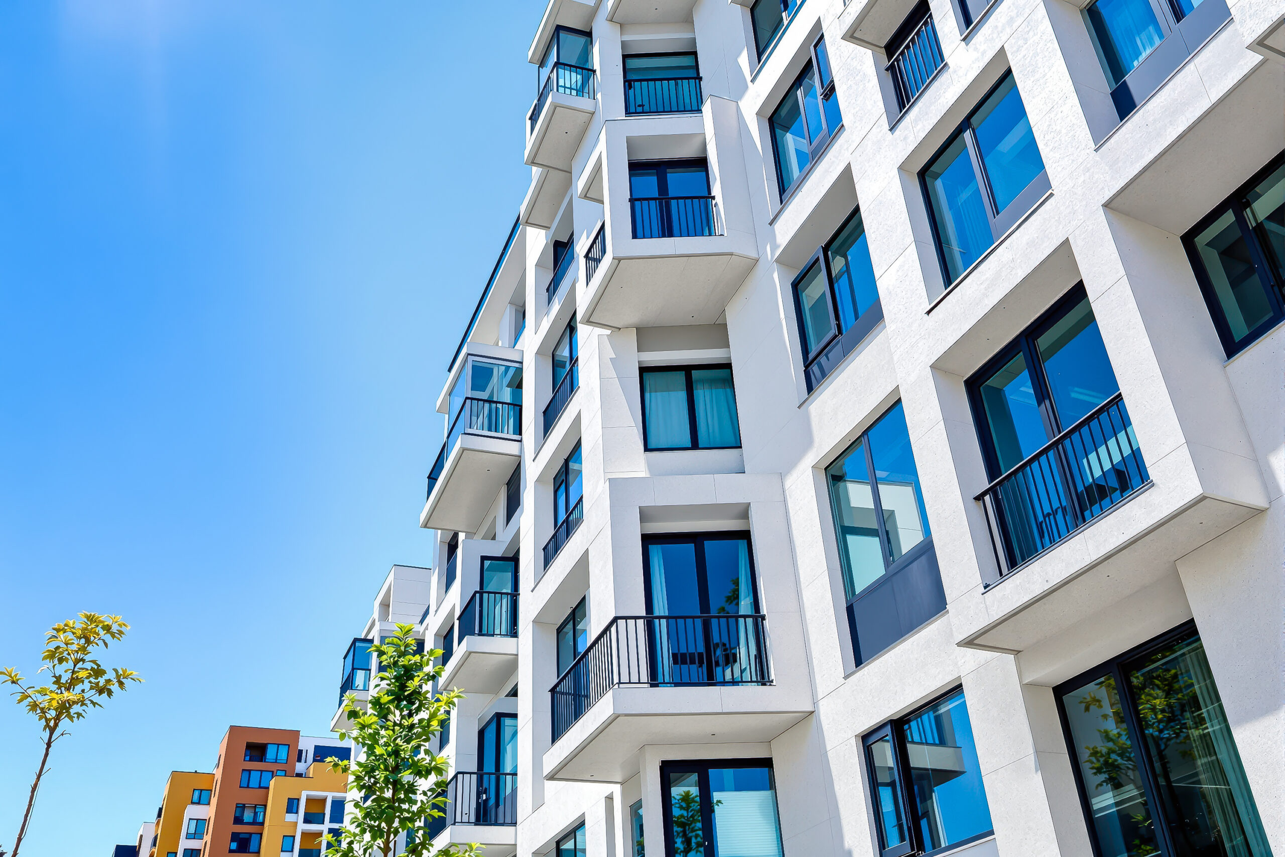 home-staging_01 Contemporary white high rise apartment buildings, with 5 floors and windows