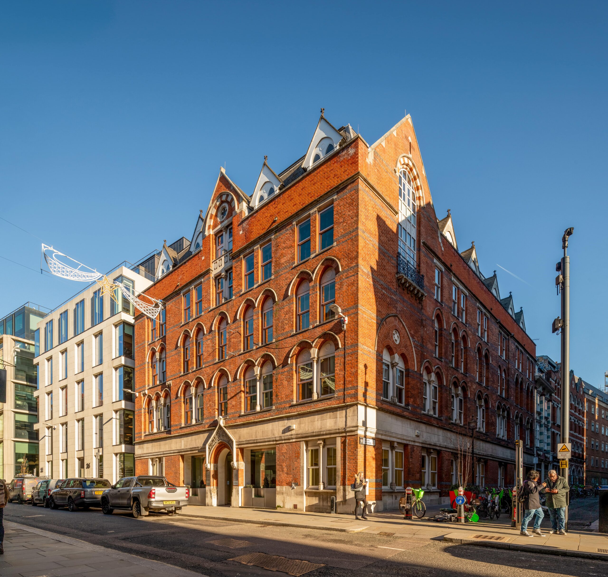 A large four-storey building on the edge of a street